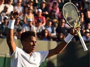 Canada's Felix Auger-Aliassime celebrates after beating France's Corentin Moutet during their men's singles second round match on the third day of the 2019 Wimbledon Championships at The All England Lawn Tennis Club in Wimbledon, southwest London, on July 3, 2019.