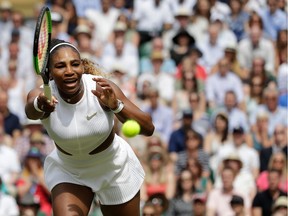 TOPSHOT - US player Serena Williams returns against Romania's Simona Halep during their women's singles final on day twelve of the 2019 Wimbledon Championships at The All England Lawn Tennis Club in Wimbledon, southwest London, on July 13, 2019.