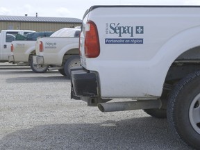 Local Input~ ANTICOSTI for Nick Van Praet's FP story - Ford crew cab trucks sit parked in front of Port-Menier's hotel restaurant. Sépaq, the government parks agency that owns the trucks, employs a significant percentage of Anticosti residents.  Photo by Marco Veltri