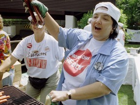 Aug. 2, 1995: Claudette Baillargeon, a worker at Reddy Memorial Hospital. offers a free hot dog to anyone who wanted one. This was the first of a series of free lunches to raise support for hospitals that were to be closed.