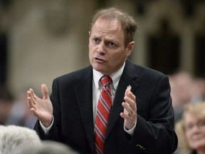 Parliamentary Secretary to the Leader of the Government in the House of Commons Kevin Lamoureux rises during Question Period in the House of Commons on Parliament Hill, in Ottawa on Friday, March 24, 2017. Some MPs are warning the high-stress, high-stakes environment of politics coupled with relentless work schedules and bouts of politically-motivated marathon voting and debating sessions are one day going to kill someone.