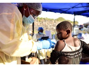 A Congolese health worker administers ebola vaccine to a child at the Himbi Health Centre in Goma, Democratic Republic of Congo, July 17, 2019.