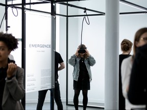 Visitors take part in Centre Phi's HUM(AI)N installation. (Sandra Larochelle/Centre Phi photo)