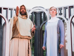 Matthew Kabwe as the disguised duke with novice nun Isabella, played by Samantha Bitonti, in Repercussion Theatre's Shakespeare-in-the-Park production of Measure For Measure. Photo credit: Valerie Baron
