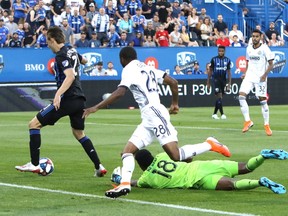 Montreal Impact midfielder Lassi Lappalainen (21) scores past Philadelphia Union goalkeeper Andre Blake (18) during the first half at Saputo Stadium on Saturday, July 27, 2019.