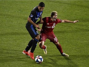 Impact defender Victor Cabrera (2) steals the ball away from Toronto FC midfielder Alejuandro Pozuelo (10) Saputo Stadium in Montreal on Saturday, July 12, 2019.