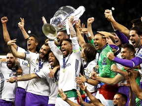 Real Madrid players celebrate after beating Juventus 4-1 in 2017 UEFA Champions League final in Cardiff, Wales.