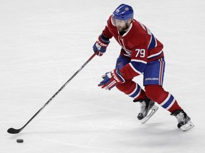 Canadiens defenceman Andrei Markov, playing in his 900th game for the team, moves the puck up ice against the Carolina Hurricanes at the Bell Centre on Feb. 7, 2016.