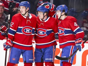 Canadiens' Max Domi, centre, receives congratulations from teammates Arturi Lehkonen, left, and Jordan Weal after scoring a goal last season. Lehkonen, whis is 6-feet, is the tallest of the three.