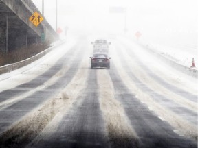 MONTREAL, QUE.: MARCH 14, 2017 -- Snowy commute into Montreal through the Turcot Yards Tuesday March 14, 2017 as a snow storm is expected to bring upwards of 25cm to the area. (John Mahoney / MONTREAL GAZETTE) ORG XMIT: 58261 - 8323