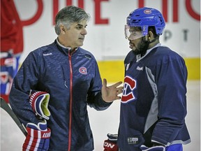 Montreal Canadiens assistant coach Jean-Jacques Daigneault has a conversation with defenceman P.K. Subban during practice on April 30, 2015. "To coach him, it was an easy task. We had our little (disagreements), but all coaches do," Daigneault said of Subban. "He is what he is and was easy to work with."