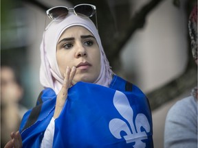 A protester takes part in a rally to denounce the adoption of Bill 21 in June.