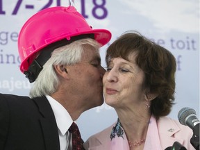 Russell Williams gives a kiss to Teresa Dellar during the sod turning ceremony for the new West Island Palliative Care Residence held on Friday June 15, 2018. They are the co-founders of the residence, which first opened in 2002.