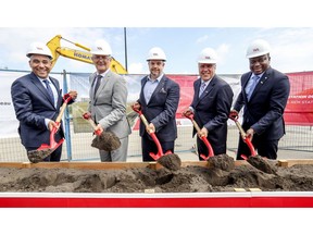 Christopher Skeete, parliamentary secretary to  premier François Legault, federal transport minister Marc Garneau, Benoit Dorais, Montreal executive committee chairperson, Philippe Rainville, president and director-general of ADM Aéroports de Montreal, and Macky Tall, president and chief executive officer of CDPQ Infra perform ground-breaking ceremony for construction of the REM station at Trudeau Airport in Dorval, west of Montreal Friday July 19, 2019.