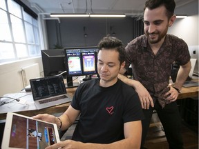 Josh Buckley, front, and Sasha Mackinnon, the co-founders of Mino Games at their offices in Montreal.