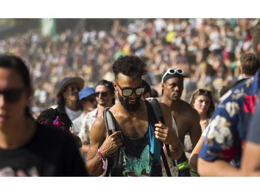 People walk between stages on Day 2 of the Osheaga Music and Arts Festival at Parc Jean-Drapeau in Montreal Saturday, August 3, 2019.