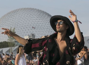 New Yorker Bryan Chavez dances to the music on Day 2 of the Osheaga Music and Arts Festival at Parc Jean-Drapeau in Montreal Saturday, August 3, 2019.