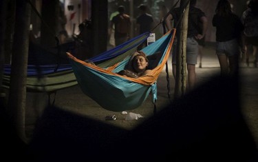 Emily Wiles of Toronto rested in a hammock as Tame Impala played on day 3 of the Osheaga Music and Arts Festival at Parc Jean-Drapeau in Montreal on Sunday, August 4, 2019.