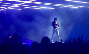 Childish Gambino is photographed from a distance as he closed the Osheaga Music and Arts Festival at Parc Jean-Drapeau in Montreal Sunday, August 4, 2019. Photographers were denied access to photograph him and the photo was taken from the crowd.