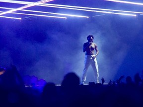 Childish Gambino is photographed from a distance as he closed the Osheaga Music and Arts Festival at Parc Jean-Drapeau in Montreal Sunday, August 4, 2019. Photographers were denied access to photograph him and the photo was taken from the crowd.