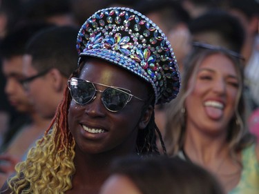 People get ready for the music of Kaskade on Day 1 of the ÎleSoniq electronic music festival at Parc Jean-Drapeau in Montreal on Friday, August 9, 2019.