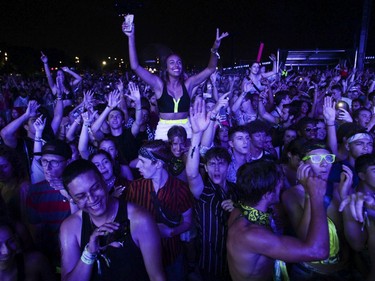 People enjoy the music of Marshmello on Day 1 of the ÎleSoniq electronic music festival at Parc Jean-Drapeau in Montreal on Friday, August 9, 2019.