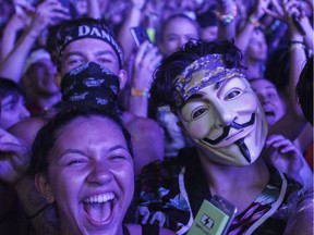 People enjoy the music of Marshmello on Day 1 of the ÎleSoniq electronic music festival at Parc Jean-Drapeau in Montreal on Friday, August 9, 2019.
