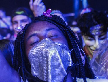 A woman gets into the music of Marshmello on Day 1 of the ÎleSoniq electronic music festival at Parc Jean-Drapeau in Montreal on Friday, August 9, 2019.