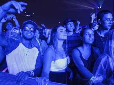 People enjoy the music of Marshmello on Day 1 of the ÎleSoniq electronic music festival at Parc Jean-Drapeau in Montreal on Friday, August 9, 2019.