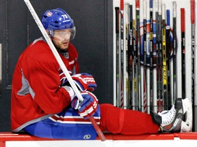 Montreal Canadiens' Andrei Markov sits on the edge of the boards during practice at their training facility in Brossard on April 25, 2014.