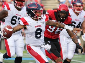 Alouettes QB Vernon Adams stands up in the face of Stampeders' Chris Casher, who had him in his sights Saturday, Aug. 17, in Calgary. Montreal returns to the field Sunday, Aug. 25, 2019, for the first time since their electrifying come-from-behind overtime win against Calgary, the defending Grey Cup champions.