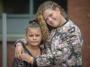 Elylla Jennings, left, and Shana-Maude Curadeau outside Sun Youth's Service Centre in Montreal on Saturday, Aug. 24, 2019. Sun Youth rewarded the two girls for helping save the life of a young boy who was drowning in a Lachine pool on Aug. 4.