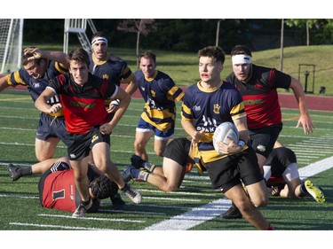 Town of Mount Royal RFC's  Stanislas Blazkowski (with ball) in action against Club de Rugby de Québec during the Quebec Cup Rugby Super League Final in Montreal on Saturday, Aug. 24, 2019.