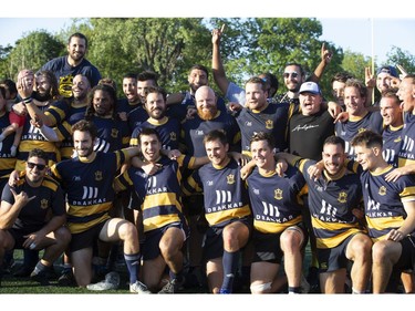 Town of Mount Royal RFC pose as they celebrate their win over Club de Rugby de Québec during the Quebec Cup Rugby Super League Final in Montreal on Saturday, Aug. 24, 2019.