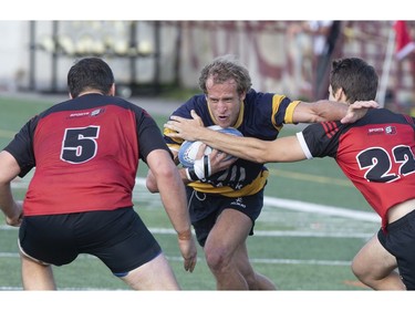 Town of Mount Royal RFC's  Brice Brousseau Rigaudie (with ball) in action against Club de Rugby de Québec during the Quebec Cup Rugby Super League Final in Montreal on Saturday, Aug. 24, 2019.