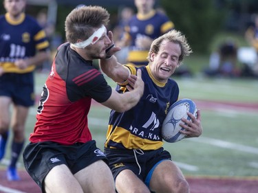 Town of Mount Royal RFC's  Brice Brousseau Rigaudie (with ball) in action against Club de Rugby de Québec during the Quebec Cup Rugby Super League Final in Montreal on Saturday, Aug. 24, 2019.