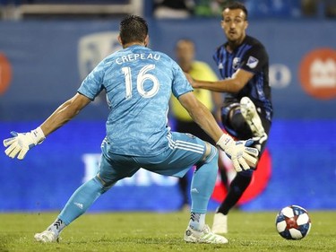 Maximiliano Urruti of the Montreal Impact crosses past Vancouver Whitecaps goalkeeper Maxime Crepeau. His pass set up an own-goal by Vancouver's Doneil Henry.