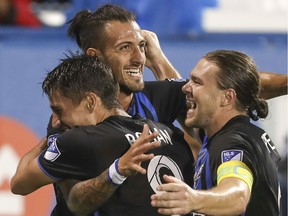 Montreal Impact's Maximiliano Urruti celebrates his goal against the Vancouver Whitecaps with team-mates Bojan and Samuel Piette during first half MLS action in Montreal on Wednesday August 28, 2019.