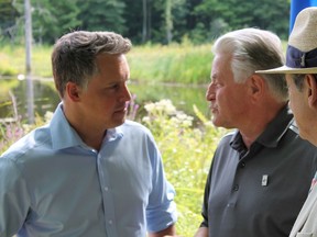 Vaudreuil-Soulanges MP Peter Schiefke (left), speaking with Rigaud Mayor Hans Gruenwald Jr., announced a federal investment of $325,000 to protect 63 hectares of Rigaud Mountain.