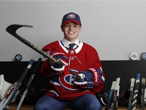 Cole Caufield poses for photo after being selected by the Canadiens in the first round (15th overall) at the 2019 NHL Draft in Vancouver.