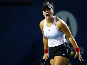 Bianca Andreescu celebrates a point against Eugenie Bouchard during in a first round match on Day 4 of the Rogers Cup at Aviva Centre on August 6, 2019, in Toronto.