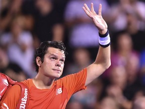 Milos Raonic of Canada salutes the crowd after forfeiting the match against Félix Auger-Aliassime of Montreal because of an injury during Day 6 of the Rogers Cup at IGA Stadium on August 7, 2019, in Montreal.