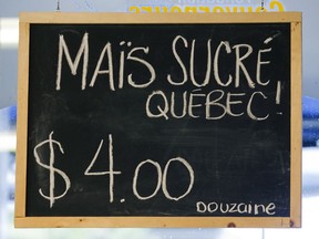 Sign for Quebec-grown corn at Les Jardins Dauphinaus in the Lachine Market in 2007.