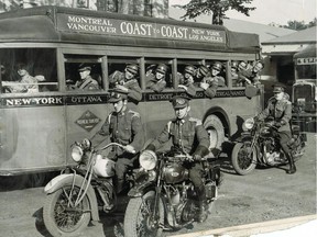 Two of the four squadrons of the 17th Duke of York's Royal Canadian Hussars leave their armoury by bus to augment the Internal Security Force of local militia units which has been assigned to mount guard over essential services in the Montreal district, in this photo dated Aug. 28, 1939. Dismounted troopers leaving with an escort of despatch riders of the 6th Duke of Connaught's Royal Canadian Hussars.