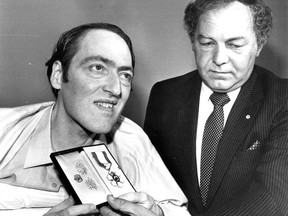 Claude Brunet (left) receives an Order of Canada from Governor General Ed Schreyer on Aug. 27, 1983 at St. Charles Borromée Hospital. Brunet, a paraplegic, was honoured for his work for patients' rights. A cropped version of this photo appeared Aug. 29, along with the story.