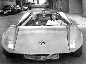 Concordia engineering professor Clyde Kwok and son Hugh, 15, road-test the Adams Probe 16 that was used in A Clockwork Orange. This photo was published in the Montreal Gazette Aug. 17, 1979 along with a story about Kwok's work restoring the car.