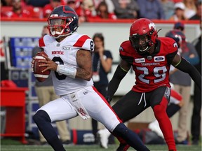 The Calgary Stampeders' Jamar Wall goes after  Montreal Alouettes quarterback Vernon Adams Jr. during CFL action at McMahon Stadium in Calgary on Saturday Aug. 17, 2019.