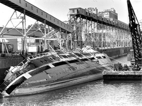 In August 1982, McAllister Towing and Salvage workers secure lines to the Royal Clipper, which had been in the Port of Montreal since 1977 after having been gutted by fire.