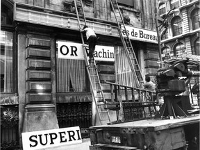Frank Phillipp and Michel Delorme install new French signs for Superior Business Machines Ltd -- reading Superior Machines de Bureau Ltée. -- at the company's office on Ste-Hélène St. on June 29, 1978, just ahead of the deadline that July 3 to conform to the provisions of Bill 101.