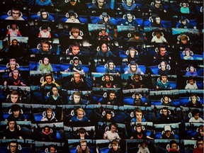TOPSHOT - The players are seen on a TV screen during the final of the Solo competition at the 2019 Fortnite World Cup July 28, 2019 inside of Arthur Ashe Stadium, in New York City.
